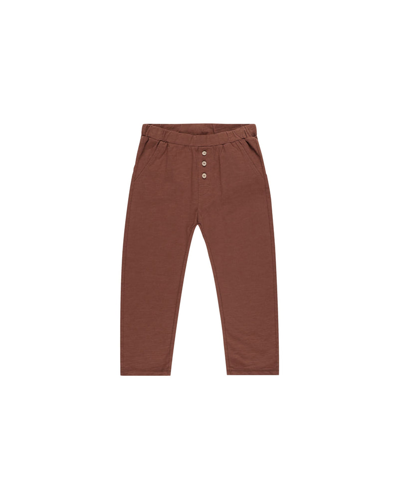 Super-soft slub knit pants with coconut button detail at center front. Featuring an elastic waistband, and a relaxed fit.

Color: Brick